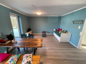 Zentrale Neubauwohnung mit Balkon